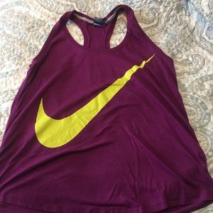 Nike purple top with bright swoosh
